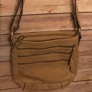 Khaki crossbody with zipper detail in front.
